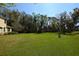 Expansive backyard with lush green lawn and natural surroundings at 6620 Lake Clark Dr, Lakeland, FL 33813
