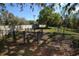 Large fenced backyard with lush green grass, offering a secure and private outdoor space at 6620 Lake Clark Dr, Lakeland, FL 33813