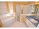 Bathroom features include a soaking tub, walk-in shower, vanity, and floral wallpaper at 6620 Lake Clark Dr, Lakeland, FL 33813