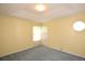 Light-filled bedroom with neutral walls, carpeted floor, and a window allowing natural light at 6620 Lake Clark Dr, Lakeland, FL 33813