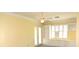 Bedroom with built-in shelves, shuttered windows, and access to the patio at 6620 Lake Clark Dr, Lakeland, FL 33813