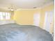 Large bedroom with neutral walls, gray carpet, and a built-in window seat at 6620 Lake Clark Dr, Lakeland, FL 33813