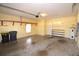 Spacious two car garage featuring yellow walls and ample storage at 6620 Lake Clark Dr, Lakeland, FL 33813