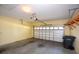 Spacious two car garage featuring yellow walls and ample storage at 6620 Lake Clark Dr, Lakeland, FL 33813