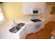 Kitchen showcasing double sinks and stainless steel appliances at 6620 Lake Clark Dr, Lakeland, FL 33813