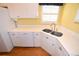 Close up shot of the kitchen, showcasing white cabinets and stainless steel appliances at 6620 Lake Clark Dr, Lakeland, FL 33813