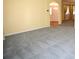 Bright room featuring neutral walls, gray carpet, and views of the front door at 6620 Lake Clark Dr, Lakeland, FL 33813