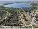 Panoramic aerial shot of a lakefront property with tree coverage, offering a private and natural setting at 6810 Crystal Beach Rd, Winter Haven, FL 33880
