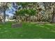 Spacious, shady backyard with mature trees and comfortable seating areas, ideal for relaxing and entertaining at 6810 Crystal Beach Rd, Winter Haven, FL 33880