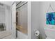 Toilet and glass enclosed bath tub shower combo at 6810 Crystal Beach Rd, Winter Haven, FL 33880
