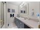 Bathroom featuring a vanity with drawers and a large, decorative mirror at 6810 Crystal Beach Rd, Winter Haven, FL 33880