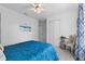 Bedroom featuring carpet, white walls, blue bedspread, and white closet doors at 6810 Crystal Beach Rd, Winter Haven, FL 33880