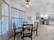 Sunlit breakfast nook with a glass table and views of the updated kitchen area at 6810 Crystal Beach Rd, Winter Haven, FL 33880