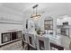 Dining room with stylish light fixture, seating for six and views of the modern kitchen at 6810 Crystal Beach Rd, Winter Haven, FL 33880