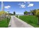 Long driveway leading to home with water view, showcasing an expansive manicured lawn at 6810 Crystal Beach Rd, Winter Haven, FL 33880