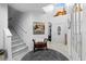 Welcoming foyer featuring staircase, neutral tile flooring, and high ceilings at 6810 Crystal Beach Rd, Winter Haven, FL 33880