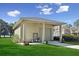 Well-maintained detached garage with covered parking on a lush green lawn offers secure parking and storage space at 6810 Crystal Beach Rd, Winter Haven, FL 33880