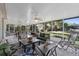 Relaxing lanai with tile flooring, ceiling fans, outdoor seating, and view of the backyard at 6810 Crystal Beach Rd, Winter Haven, FL 33880