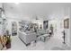 Bright, open-concept living room with tile floors, neutral decor and multiple seating areas at 6810 Crystal Beach Rd, Winter Haven, FL 33880