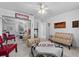 Comfortable living room with mirrored closet doors, ceiling fan, neutral walls, and carpet at 6810 Crystal Beach Rd, Winter Haven, FL 33880