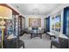 Inviting living room with cozy seating, display cabinets, and ample natural light at 6810 Crystal Beach Rd, Winter Haven, FL 33880