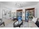 Inviting living room with hardwood floors, comfortable seating, and elegant display cabinet at 6810 Crystal Beach Rd, Winter Haven, FL 33880