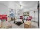 Comfortable living room with desk, ceiling fan, neutral walls, and carpet at 6810 Crystal Beach Rd, Winter Haven, FL 33880