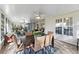 Inviting screened-in porch features tile flooring, ceiling fans, and a spacious dining area with stylish furniture at 6810 Crystal Beach Rd, Winter Haven, FL 33880