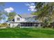 Large screened porch overlooking well-manicured backyard; perfect outdoor living space at 6810 Crystal Beach Rd, Winter Haven, FL 33880