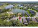 Aerial view of a house next to a lake, golf course, and other residential properties at 6907 Eagle Ridge Blvd, Lakeland, FL 33813