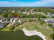 A bird's eye view of a neighborhood with access to a golf course and a lake at 6907 Eagle Ridge Blvd, Lakeland, FL 33813