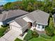 A bird's eye view showcases lush landscaping around this charming single Gathering home at 6907 Eagle Ridge Blvd, Lakeland, FL 33813