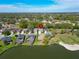 Aerial view of a house next to a golf course, lake, and other residential properties at 6907 Eagle Ridge Blvd, Lakeland, FL 33813