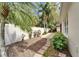 Lush backyard featuring tropical landscaping, stone pavers and a privacy fence at 6907 Eagle Ridge Blvd, Lakeland, FL 33813