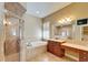 Bathroom with a shower, bathtub, large mirror, vanity, and tile flooring at 6907 Eagle Ridge Blvd, Lakeland, FL 33813