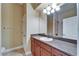 Bathroom features a large mirror, a vanity, and tile flooring at 6907 Eagle Ridge Blvd, Lakeland, FL 33813
