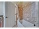Bathroom features a tiled shower, a bathtub, and tile flooring at 6907 Eagle Ridge Blvd, Lakeland, FL 33813