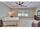 Spacious bedroom with a ceiling fan, large window and neutral colored walls at 6907 Eagle Ridge Blvd, Lakeland, FL 33813