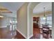 Open floor plan showcases a dining area next to the kitchen with hardwood floors and natural lighting at 6907 Eagle Ridge Blvd, Lakeland, FL 33813