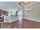 Open layout featuring hardwood floors, an elegant chandelier, and a kitchen with granite countertops at 6907 Eagle Ridge Blvd, Lakeland, FL 33813