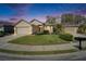 Charming home with a well-manicured lawn, a two-car garage, and inviting curb appeal at 6907 Eagle Ridge Blvd, Lakeland, FL 33813