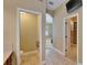 Hallway with a toilet room, walk-in closet, and tile flooring at 6907 Eagle Ridge Blvd, Lakeland, FL 33813