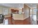 Spacious kitchen with hardwood floors, granite countertops, stainless steel appliances, and ample cabinet space at 6907 Eagle Ridge Blvd, Lakeland, FL 33813