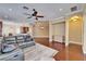 Open living space features a ceiling fan, hardwood floors, and access to the kitchen and dining areas at 6907 Eagle Ridge Blvd, Lakeland, FL 33813