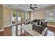 Bright living room with hardwood floors and French doors leading to the outdoor patio at 6907 Eagle Ridge Blvd, Lakeland, FL 33813