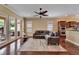 Comfortable living room with a ceiling fan and large glass doors leading to the patio at 6907 Eagle Ridge Blvd, Lakeland, FL 33813