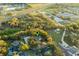 Birds eye view of the home, nestled among trees and close to highway, showcasing property location at 7010 Parliament Pl, Lakeland, FL 33809