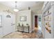 Inviting home foyer with a decorative front door, high ceilings, beautiful flooring, and an open view at 7010 Parliament Pl, Lakeland, FL 33809