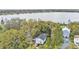 Scenic aerial view of a lovely home nestled among lush trees with lake views at 723 W Patterson St, Lakeland, FL 33803