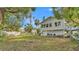 Expansive backyard with a fire pit area and well-maintained lawn, perfect for outdoor gatherings at 723 W Patterson St, Lakeland, FL 33803